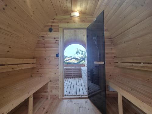 an inside view of a sauna with an open door at Loft Apartment mit großer Badewanne B in Mügeln
