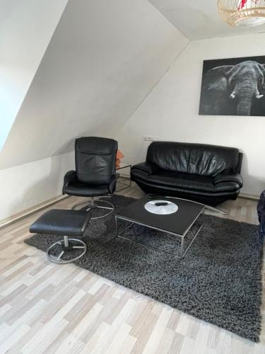 a living room with two chairs and a couch at 3 Room City Apartment 90m2 in Heilbronn