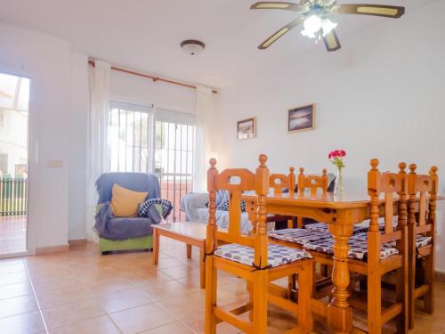 a dining room with a table and chairs at Chiclana.Balconera.1ªlínea playa in Chiclana de la Frontera