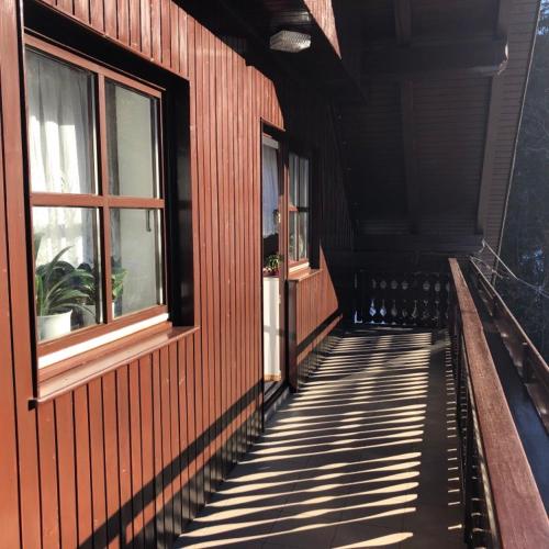 a shadow of a building with windows on it at Apartma ČVRSTA TROJKA in Jesenice
