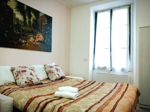 Кровать или кровати в номере La finestra sul centro di Monza