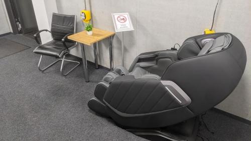 a black car seat with a table and two chairs at BUSINESS-MOTEL, free XL-Parking, eCharging, Self Checkin, Massage, Sauna in Heimsheim