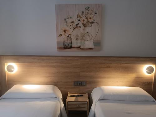 ApartamentosTuristicos Avila Puerta del Alcazar 0-1にあるベッド