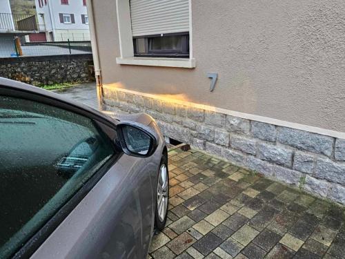 a car parked in front of a building at Studio type chalet in Gérardmer
