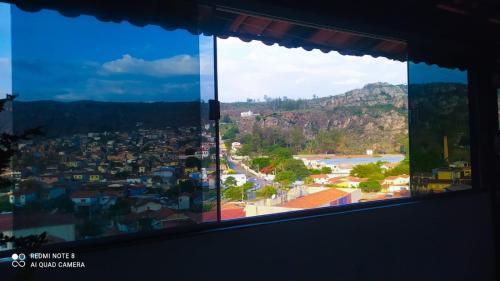 a view of a city from a window at CASA AGRADÁVEL in Diamantina