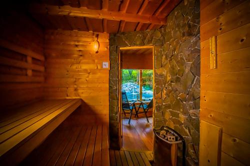 an inside view of a sauna with a window at Holiday Raj in Bešeňová