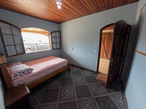 Postel nebo postele na pokoji v ubytování Casa espaçosa em Matinhos