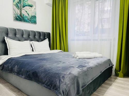 Ένα ή περισσότερα κρεβάτια σε δωμάτιο στο Apartament Dany