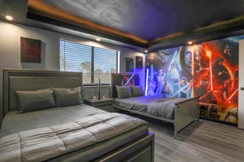 a bedroom with two beds and a painting on the wall at Themed Luxury 6BR Getaway with Resort Amenities in Orlando