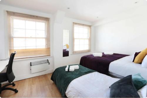 Lovely Private Bedrooms in Euston Station - 121 tesisinde bir odada yatak veya yataklar