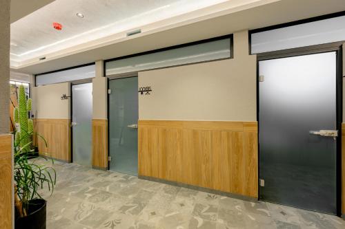 a row of elevator doors in a building at Aquamarine - Beach & SPA Hotel- All inclusive in Kranevo
