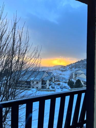 a view from a balcony with snow on the ground at Superbe appartement Font Romeu La Pardallera in Font Romeu Odeillo Via