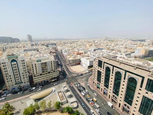 an aerial view of a city with cars and buildings at The Hosteller in Dubai