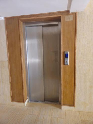 a elevator in a building with a metal door at Apparemment Tout Confort Wifi in Essaouira