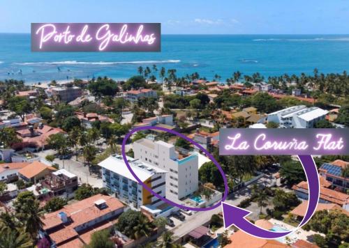 an aerial view of a city with a white building at La Coruña Flat Makaranduba in Porto De Galinhas