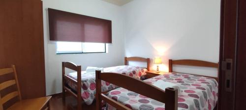 Кровать или кровати в номере Apartamento da Matilde