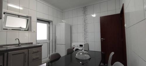 a small kitchen with a sink and a window at Apartamento da Matilde in Santa Cruz das Flores