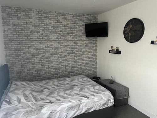 Ένα ή περισσότερα κρεβάτια σε δωμάτιο στο Appartement résidence théâtre
