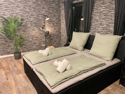 two beds sitting on a couch in a room at Berlin Loft nähe Olympiastadion in Berlin