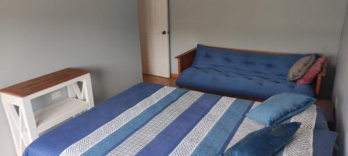 Säng eller sängar i ett rum på CasaMagnolia