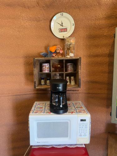 a microwave with a coffee pot on top of it at JMA Granary in Riverton