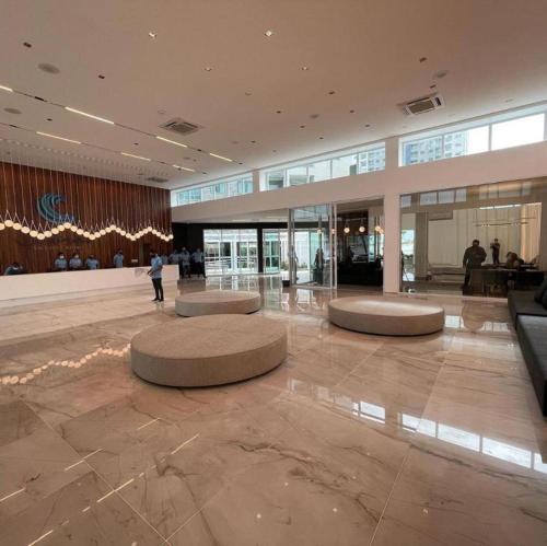 a lobby with circular seating in a large building at Salinas Exclusive Resort in Salinópolis