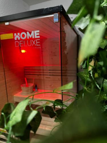 a red door with a sign that says someone deliver at RheinMosel Glück Wellness in Koblenz