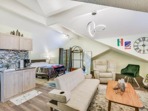 a living room with a couch and a bed at Cozy Oasis in SE Austin in Buda