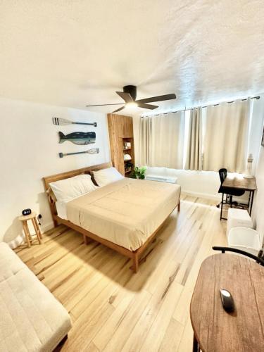 a bedroom with a bed and a ceiling fan at OCEAN FRONT Condo Daytona Beach! in Daytona Beach