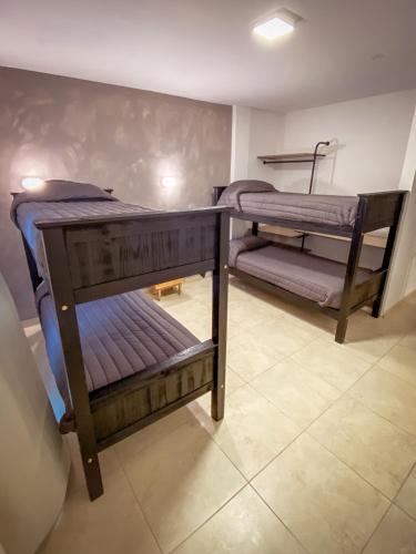 a room with two bunk beds in a room at Las Golondrinas Mar del Plata in Mar del Plata
