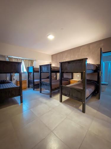 a group of bunk beds in a room at Las Golondrinas Mar del Plata in Mar del Plata