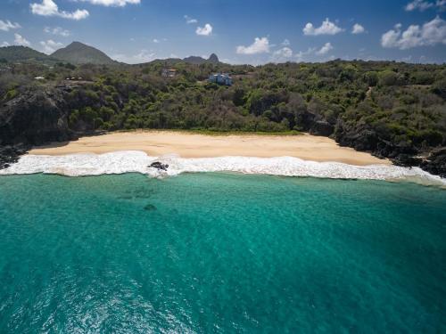 an aerial view of a beach in the ocean at Pousada Mar em Mim in Fernando de Noronha