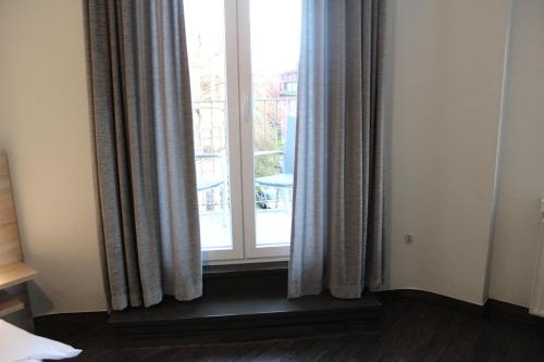 Ένα ή περισσότερα κρεβάτια σε δωμάτιο στο Hotel Mozart Bonn