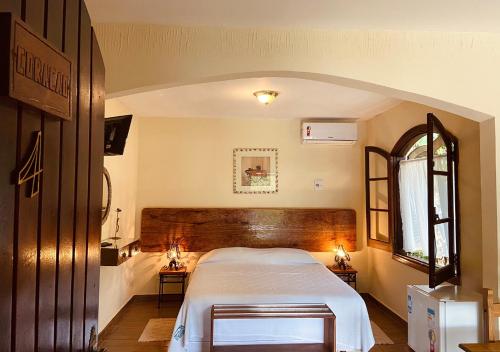 Cama o camas de una habitación en Hotel da Cachoeira