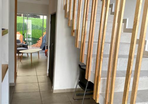 a hallway with a staircase in a house at Casa familiar en condominio privado cerca de playa in Cancún