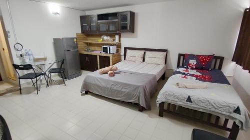 Katil atau katil-katil dalam bilik di Popular The best muangthongthani 日常房间公寓