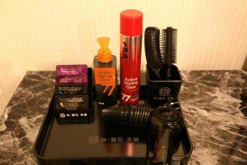 a counter with hair brushes and other items on it at New World Hotel Yongsan in Seoul