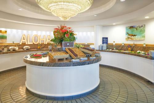 a lobby with a food counter in a mall at Hilton Waikoloa Village in Waikoloa