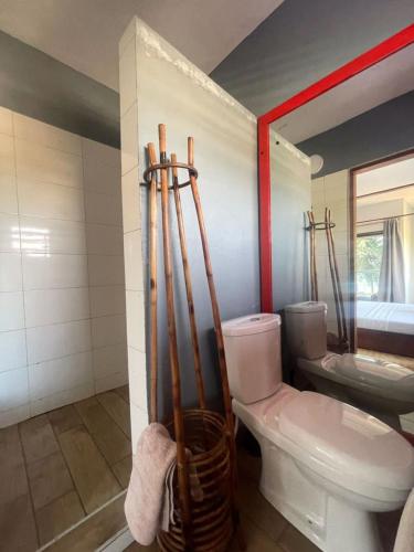 a bathroom with a toilet and a sink at Afiki in Ankwanda