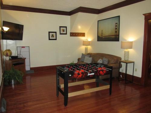 a living room with a couch and a table at Victorian Home Near Downtown in Minneapolis