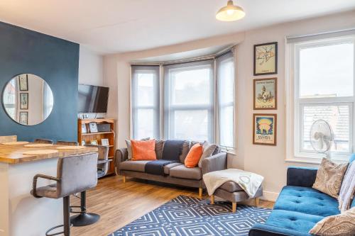 a living room with a couch and a table at Folkestone Ramblers Rest in Kent