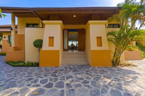 a house on the beach with palm trees at Luxury 5 Bedroom Villa Close to Beach SRS in Hua Hin