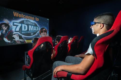 a group of people sitting in chairs watching a movie at Leonardo Club Hotel Dead Sea - All Inclusive in Ein Bokek
