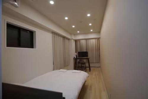 Postel nebo postele na pokoji v ubytování TokyoGuest 浜町