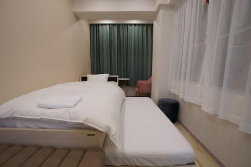 Postel nebo postele na pokoji v ubytování TokyoGuest 浜町