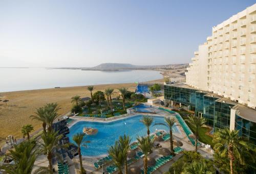 an aerial view of a resort with a pool and a beach at Leonardo Club Hotel Dead Sea - All Inclusive in Ein Bokek