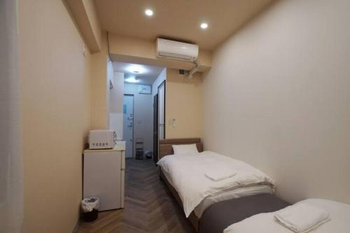Postel nebo postele na pokoji v ubytování TokyoGuest 浜町