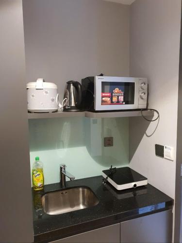 Kuchyň nebo kuchyňský kout v ubytování Sun Residence