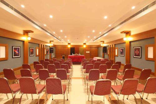 a conference room with chairs and a table in it at National Park Residency Kottayam in Ettumānūr
