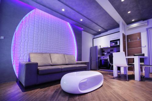 a living room with a couch and a table at Apartments Belgrade in Belgrade